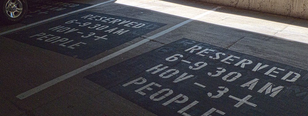stenciled markings on reserved HOV parking spaces