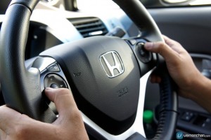 hands on a steering wheel at 9 and 3 position